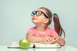 © Myst - beautiful cute little girl with smiling face looking up and turning the page of book