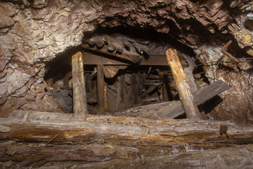 Underground abandoned gold iron ore mine shaft tunnel gallery passage wtih collapse