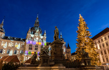 Christmas Time In Graz,the Capital Of Styria,austria. Christmassy Illuminated Townhall On The Main Square (Hauptplatz) Of The City Of Graz With Christmas Tree And The Memorial For Erzherzog Johann 