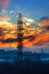 Wall Mural - High-voltage electricity pylon and power line against the sunset sky