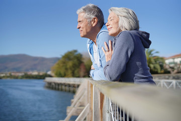  Senior couple in sportswear enjoying the sun outdoors