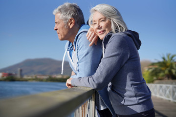 Wall Mural -  Senior couple in sportswear enjoying the sun outdoors