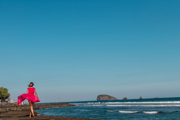 Wall Mural - Young woman on a tropical beach of Bali island. Indonesia.