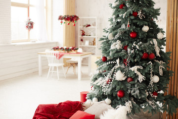 winter holidays decor. studio preparetions. rich decorated new year tree stands with present boxes i