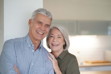 Wall Mural -  Loving portrait of happy senior couple at home