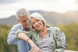© goodluz - Loving portrait of modern senior couple outdoors
