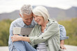 © goodluz - Loving portrait of modern senior couple outdoors