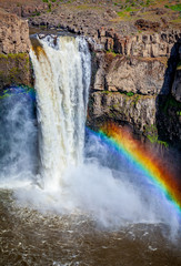 tall waterfall with rainbow