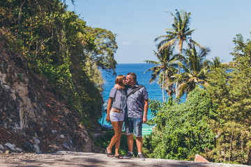 Wall Mural - Young honeymoon couple on a beatiful tropical background. Bali island.