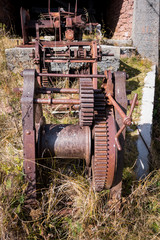 Rusty gears and winch mechanism.  Old machinery.