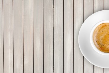 Wall Mural - Cup of coffee on wooden background