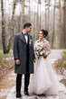 © ksyusha_yanovich - Portrait of happy young lovers of the bride and groom in the forest alley. Wedding day