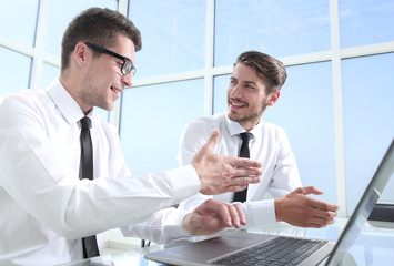 Businessmen wearing suits shaking hands