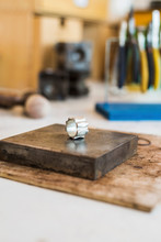 Close-up Of Silver Ring On Metal In Workshop