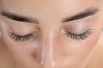 Canvas Print - Young woman with beautiful eyelashes, closeup view