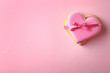 Decorated heart shaped cookies and space for text on color background, top view