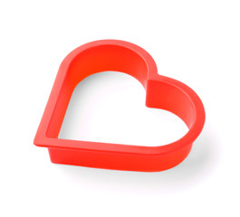 Heart shaped cookie cutter on white background