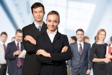 Canvas Print - Confident young Business couple with crossed hands on background