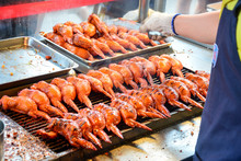 Street Food, Grilled Chicken Wings Cooking On Metal Stove, Most Of Popular Snack At Pingxi, Taiwan (selective Focus)