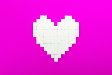 Wall Mural - Heart of sugar cubes, pink background