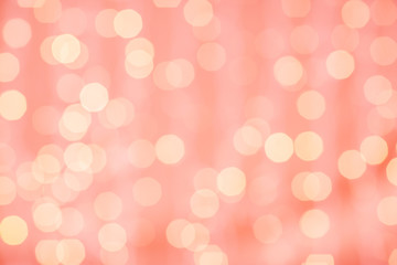 Wall Mural - holidays and design concept - blurred bokeh lights in living coral, color of the year 2019