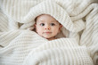 © Lisa Tichané - Close up of baby girl wrapped in blanket