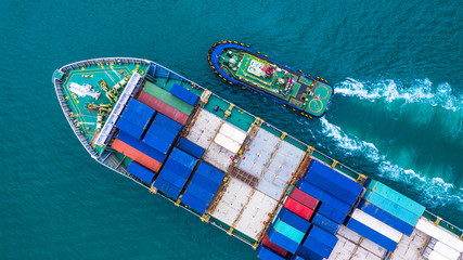 Aerial view container ship carrying container for import and export, business logistic and transportation by ship in open sea.