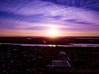 Wall Mural - purple vionet sunset sky and river aerial shot f