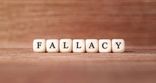 Word FALLACY Made With Wood Building Blocks
