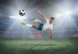 © Andrii IURLOV - Soccer player on a football field in dynamic action at summer day