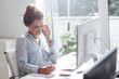 © LStockStudio - Businesswoman Working on a Desktop Computer