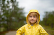 © Westend61 - Portrait of blond girl wearing raincoat outdoors