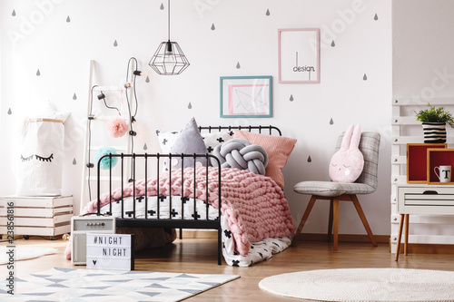Cozy Pastel Pink Woolen Blanket On Single Industrial Bed In