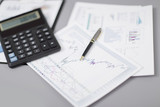 Fototapeta  - close up.pen, financial chart and calculator on the businessman'