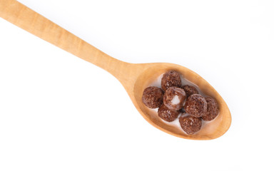 Wall Mural - wood spoon of chocolate Cereal with milk isolated on white background.