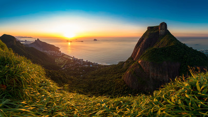 Fototapete - Scenic Panoramic View of Sunrise in Rio de Janeiro City, Pedra da Gavea, Sao Conrado Beach, and Two Brothers Mountain With Favela Rocinha