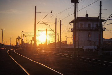 Wall Mural - railway at sunset public transport. transportation of people and freight.