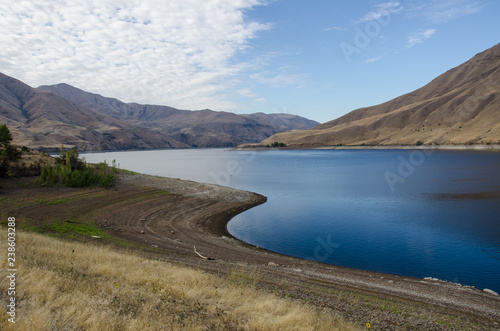 Fotografie, Obraz Extreme Drought Conditions as Water Levels Drop in Reservoir
