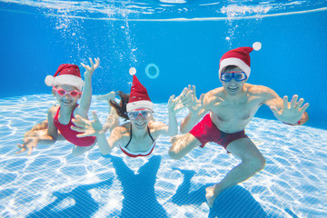 family  in swimming pool