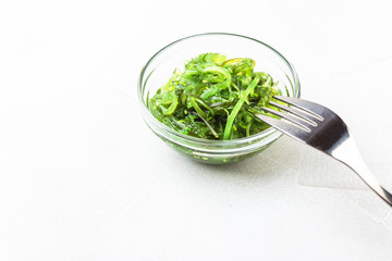 Sticker - Wakame seaweed salad with sesame seed. Traditional Japanese food.