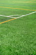 © Formatoriginal - Soccer field with a new artificial turf field, white corner marking. Close up. Soccer background. Copy space
