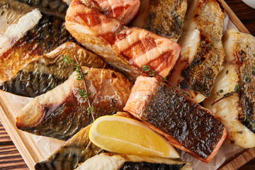 Wall Mural - Assorted grilled fish on wooden board