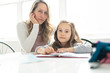 © Louis-Paul Photo - A Mother and Child doing homework at home