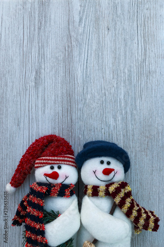 Fotografie, Obraz Christmas still life snowmen decorations on white wooden plank background