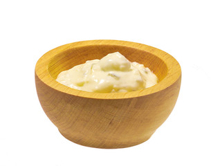 Tartar sauce in wooden bowl isolated on white background