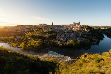 Wall Mural - Panoramic view of the medieval center of the city of Toledo, Spain. It features the Tejo river, the Cathedral and Alcazar of Toledo, Spain..