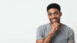 © Prostock-studio - Young african american man smiling with hand on chin