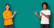 © Prostock-studio - Friendly teen boys pointing on copy space