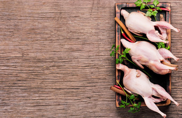 Sticker - Fresh raw quail on a kitchen board and ingredients.Quail meat