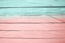 Wooden Half Painted Background With Coral And Blue Colors.